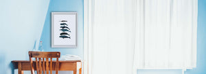 framed whale print on wall